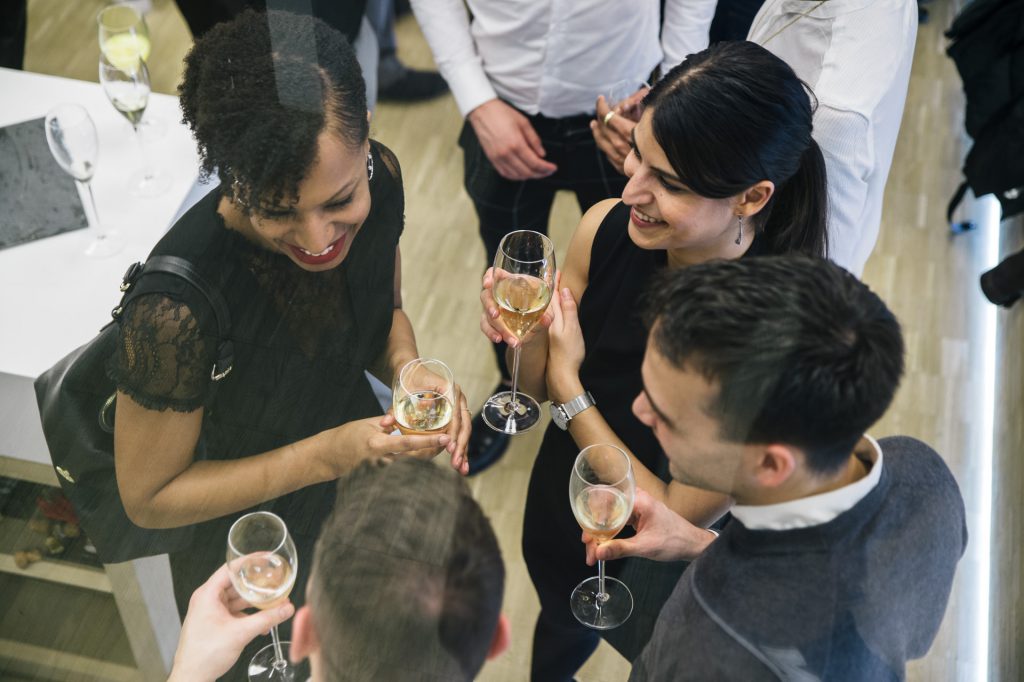 4 people having a champagne during an event