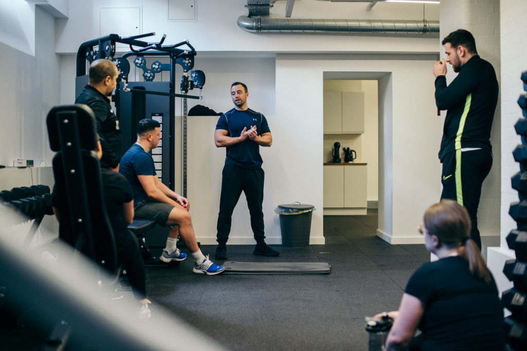 PT Nick Aldridge gives instructions at PT HUB, Hoxton, London